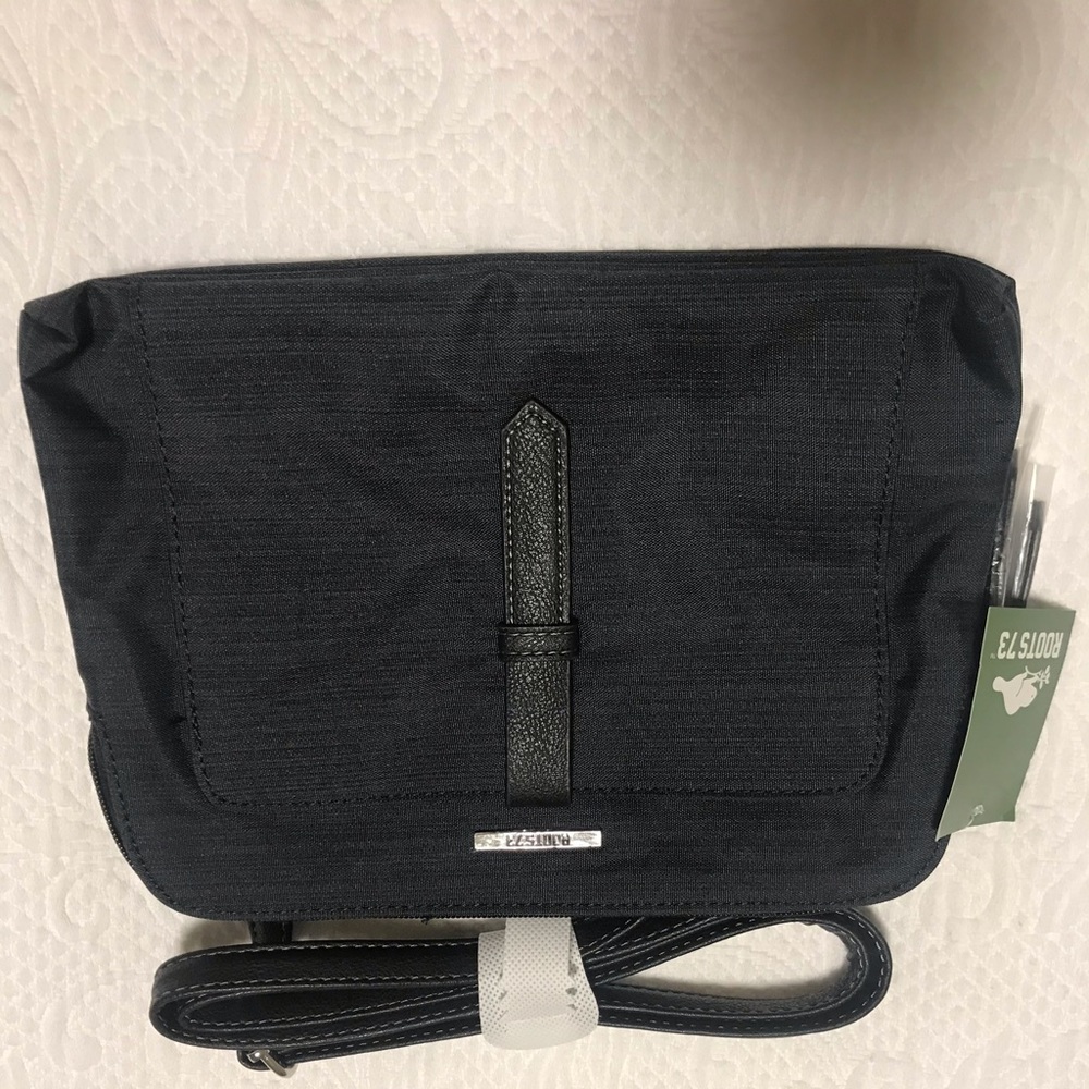 Roots cross body bag